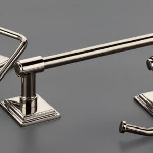 A set of three bathroom accessories in brushed nickel.