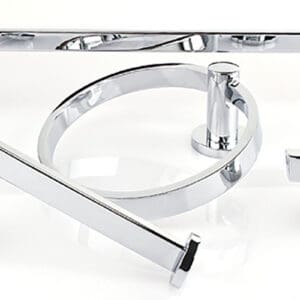 A close up of some chrome bathroom accessories