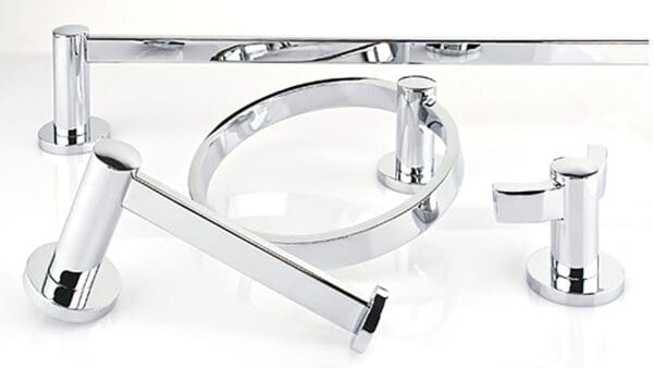 A close up of some chrome bathroom accessories