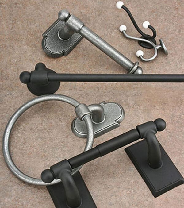 A close up of some black and silver bathroom accessories