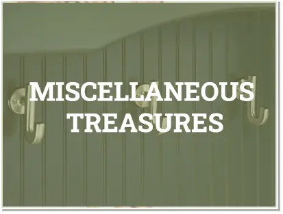 A green wall with the words miscellaneous treasures written in front of it.