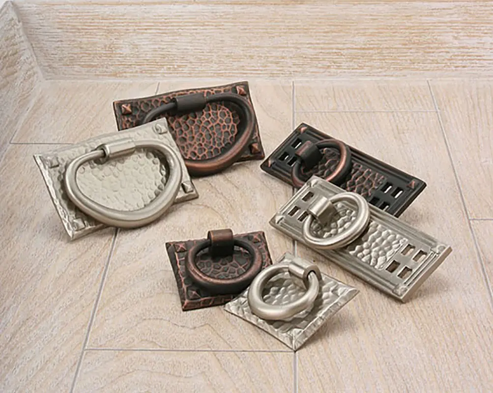 A group of different types of handles on the floor.