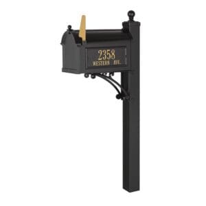 A black mailbox with gold lettering on top of it.