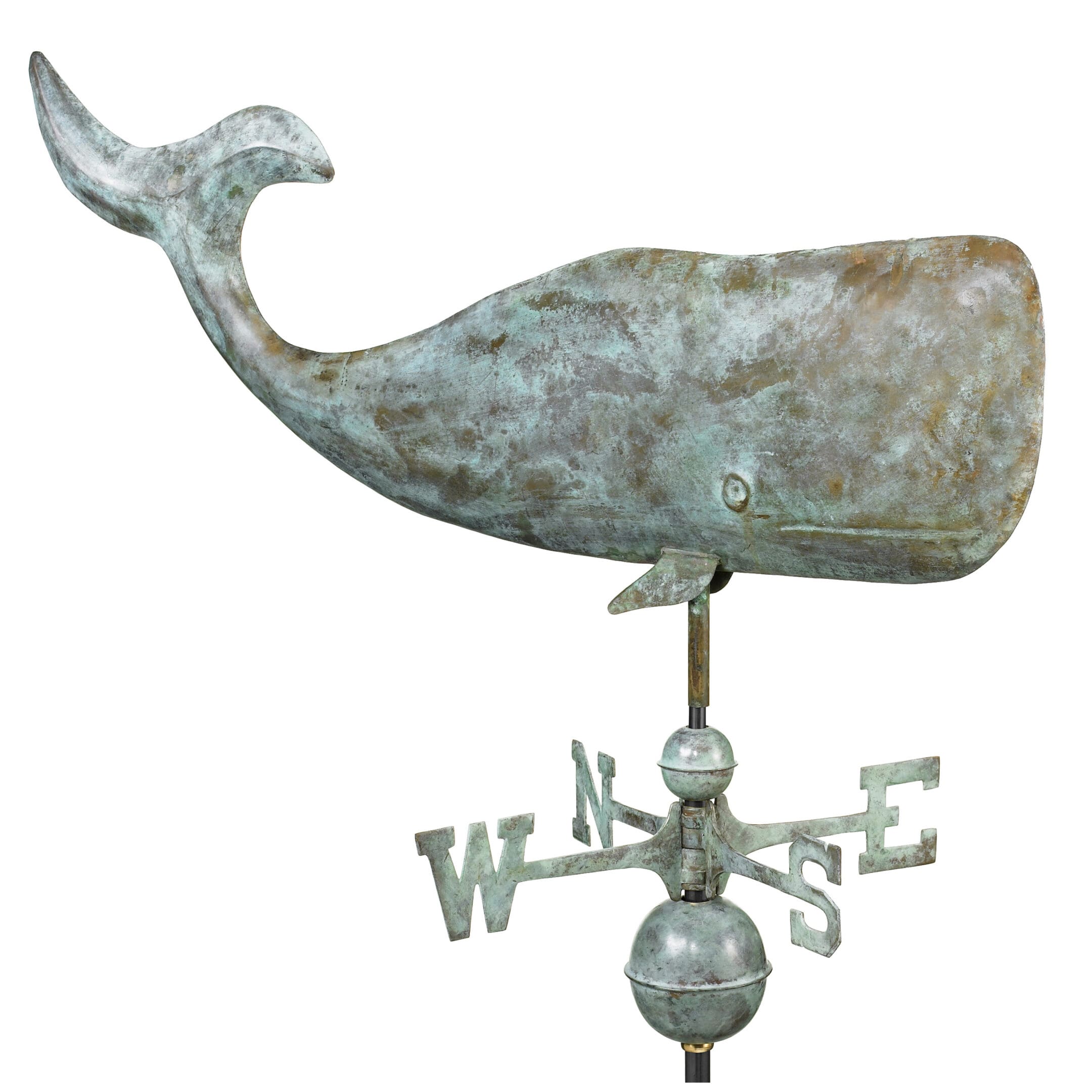 A weathervane of an animal with the word " whale " on it.