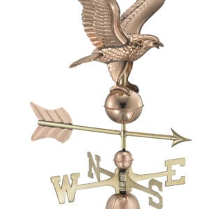 A gold eagle weathervane with brass balls and an arrow.